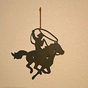 Metal cowboy roper